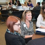 Two guests listen intently